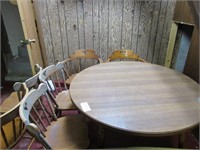Round maple table with 6 chairs