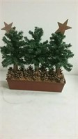 Small holiday tree decor with pine cones
