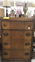 Waterfall style dresser w/ items on top