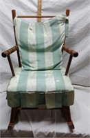 Child's rocking chair with satin covered cushions