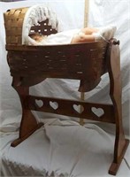 Rocking basket woven cradle on wood stand  & doll
