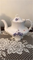 Vintage porcelain tea pot with flowers