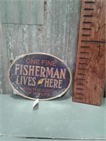 Fisherman Lives Here oval tin sign