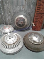 Set of 4 old single assorted hubcaps
