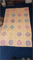 Hand made quilt with cross stitching