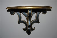 Pair of ebonized and guilt wall sconce