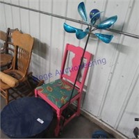 Pink wood chair, yard spinner, tin table