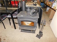 Wood stove c/w stove pipe & shield - barely used