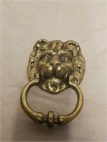 Brass lion door knocker