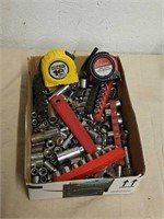 Group of sockets and tape measures