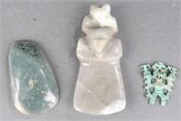3 jade and copper pendants.