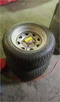Two small tractor trailer tires