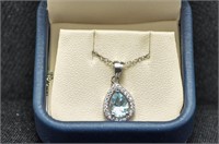 Blue topaz and diamond necklace