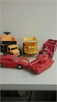 Group of 5 larger plastic trucks and tank