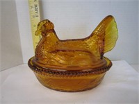Amber glass hen on the nest