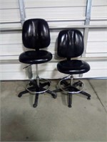 2 black office chairs