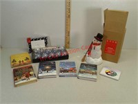 Various Christmas items, glass ornaments, books,
