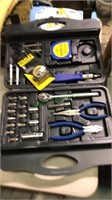 Multi piece tool kit with a molded plastic caring
