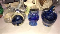 Three control bubble paperweights and cobalt