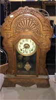 Antique oak gingerbread Clock, has a finial but