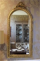 Mirror in wood frame with guilt and guesso motif