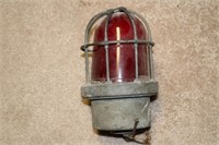 Old industrial light with red lense