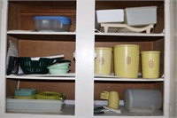 Contents of cabinet including Tupperware canister
