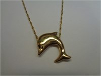 14kt gold dolphin pendant on a 14kt gold Necklace