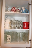 Cupboard with mugs and glasses-top of fridge