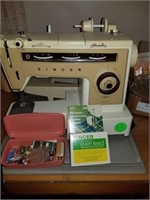 SINGER SEWING MACHINE AND ALL NOTIONS AND EXTRAS