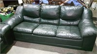 Leather three-seat couch with lots of wear