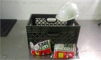 Plastic bin with hard hat and six pairs of shoe