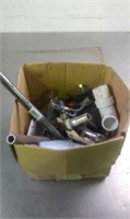 Box of plumbing supplies and fixtures