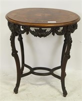 CIRCA 1920'S CARVED AND INLAID OVAL TABLE
