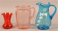 Three Various Glass Pitchers. One with enamel