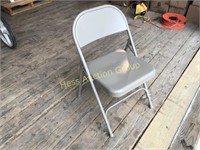 Box of four brand new metal folding chairs