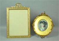 BRONZE EASEL PICTURE FRAME AND A PAINTED PORTRAIT