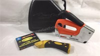 Powershot staple gun with staples and case