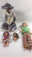 Group of four vintage dolls one is a music player