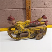 Vintage Tin Toy Boy on Sled Car