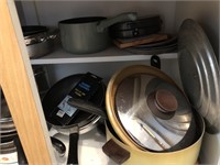 Contents of kitchen cabinet of pots and pans