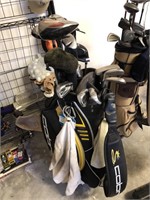 Blue and yellow golf bag with assorted  golf clubs