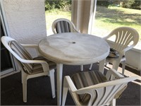 White outdoor patio set table for chairs
