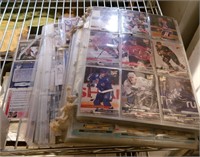 Shelf Of Baseball And Hockey Cards.