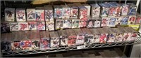 Whole Shelf Of Hockey And Baseball Cards.
