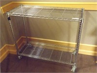 STAINLESS STEEL WHEEL CART IS 3' X 31" X 14"