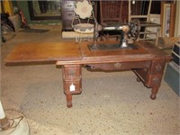 Singer sewing machine in low cabinet