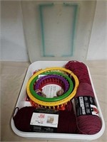 Storage tote with knitting looms and yarn