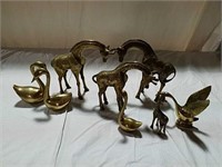 Brass giraffes and birds