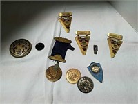 Badges and paperweight